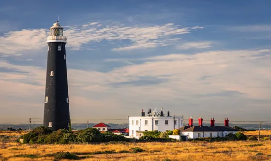 The old lighthouse at Dungeness on the Kent coast south east England UK