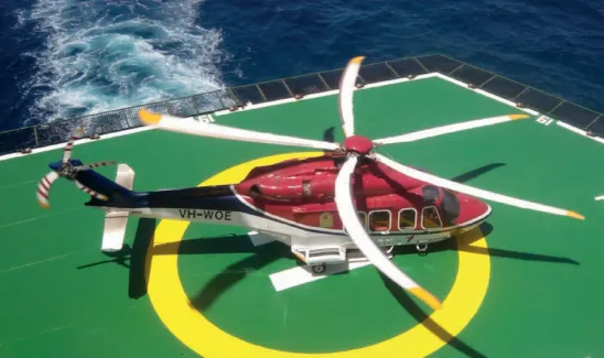 Helicopter on helipad on a ship
